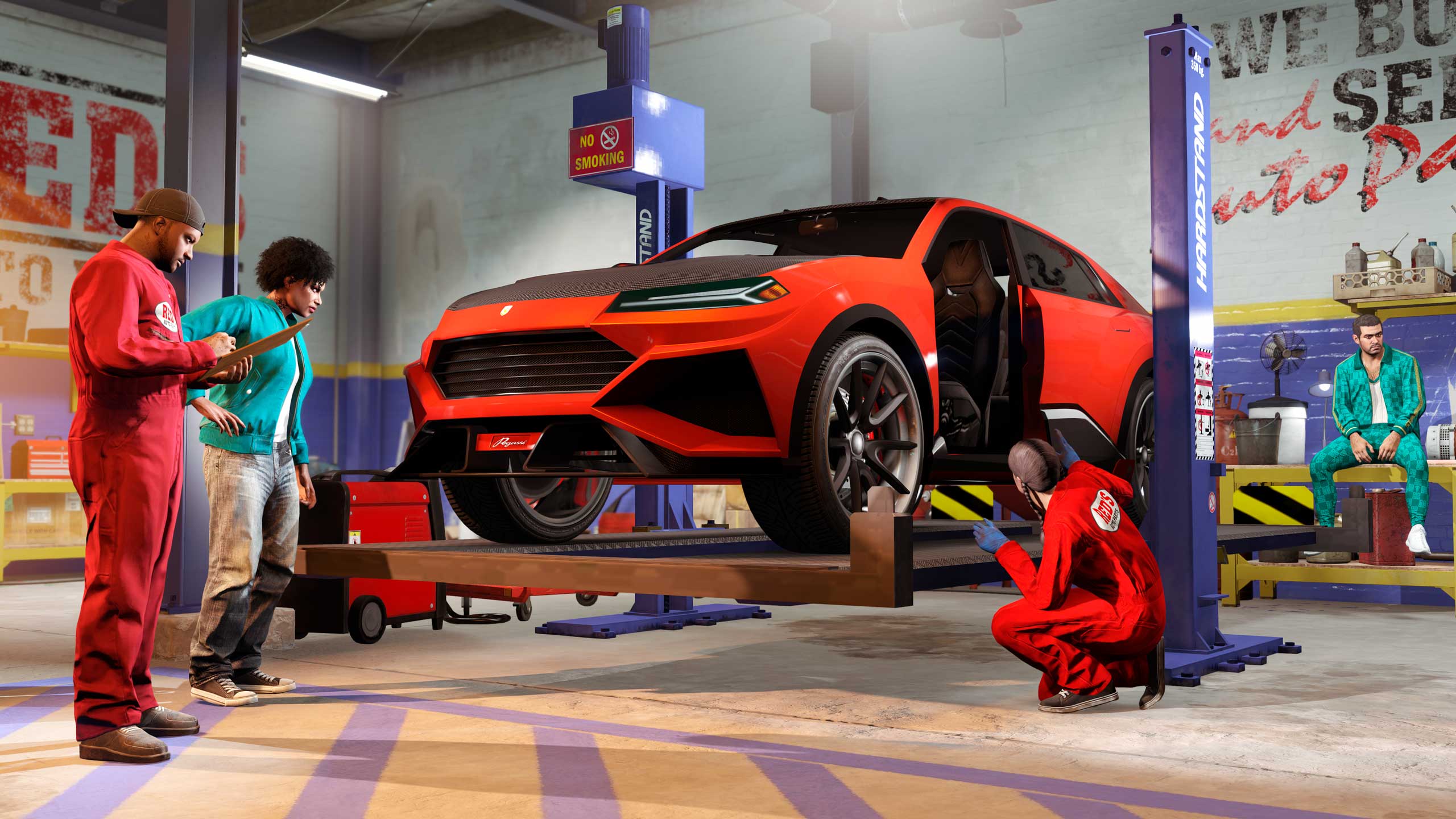 Mechanics at Red’s Garage working on a Pegassi Toros. 