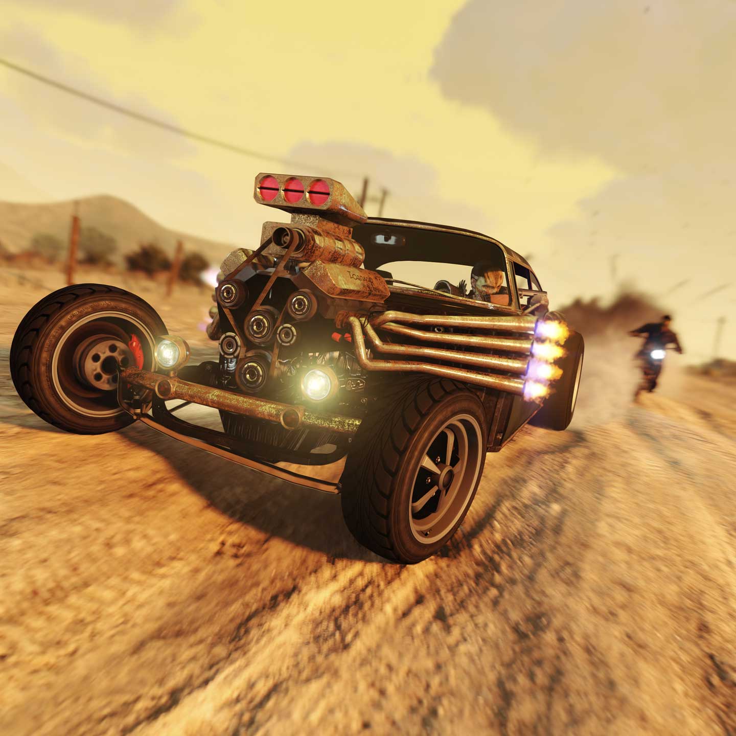 A Declasse Tornado Rat Rod car speeds along a desert road with eight exhausts with flames coming out of the front engine.