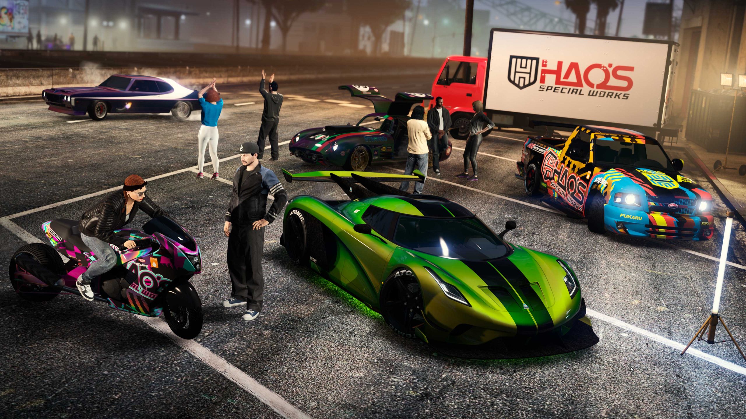 Customized vehicles parked at a car meet as people gather. 